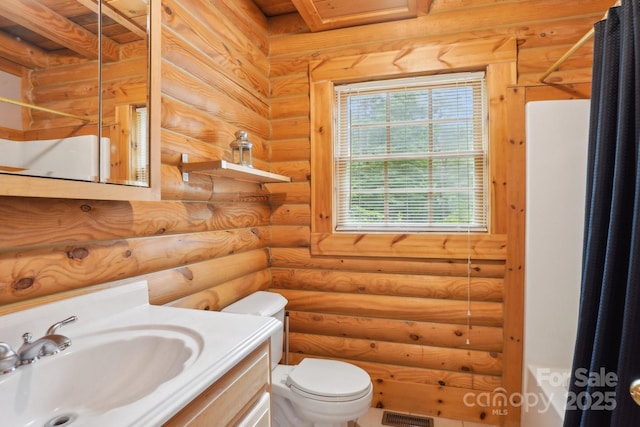 10583 Earnhardt Lake Rd, Davidson, NC 28036 - bathroom featuring toilet, vanity, and log walls