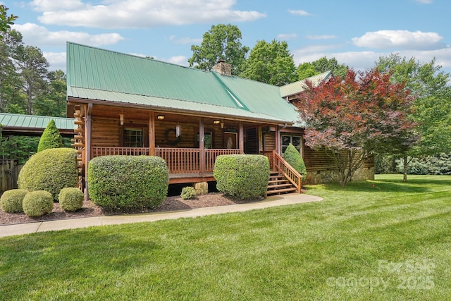 10583 Earnhardt Lake Rd, Davidson, NC 28036 - view of front of home with a porch, a chimney, a front yard, metal roof, and log siding