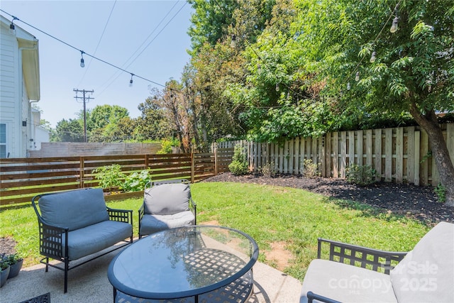 view of yard with a fenced backyard and a patio