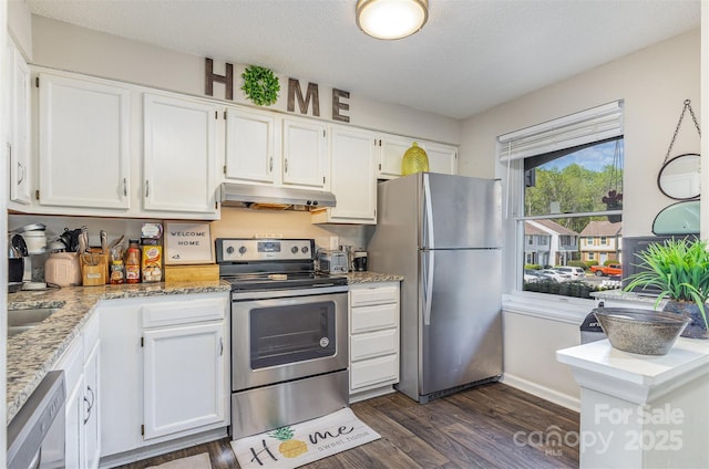 7324 Pebblestone Dr Unit E, Charlotte, NC 28212 - kitchen with white cabinets, dark wood-style flooring, a textured ceiling, under cabinet range hood, and stainless steel appliances