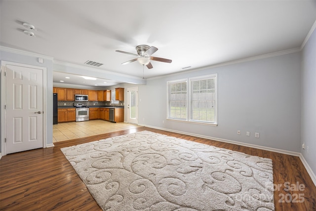4219 Shasta Cir, Clover, SC 29710 - unfurnished living room featuring ceiling fan, light wood-style floors, baseboards, ornamental molding, and recessed lighting