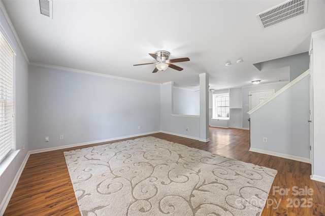 4219 Shasta Cir, Clover, SC 29710 - unfurnished living room with ceiling fan, dark wood-style flooring, baseboards, ornamental molding, and stairway