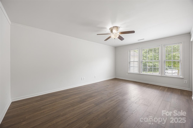 4219 Shasta Cir, Clover, SC 29710 - empty room featuring ceiling fan, dark wood-type flooring, baseboards, and ornamental molding