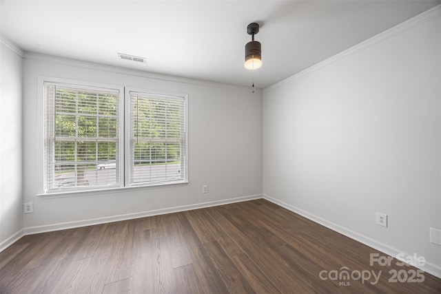 4219 Shasta Cir, Clover, SC 29710 - spare room featuring crown molding, ceiling fan, dark wood-style floors, and baseboards