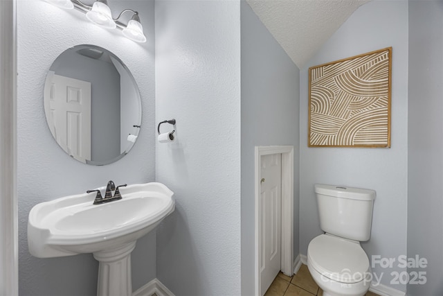 4219 Shasta Cir, Clover, SC 29710 - bathroom with tile patterned flooring, lofted ceiling, toilet, and a textured ceiling