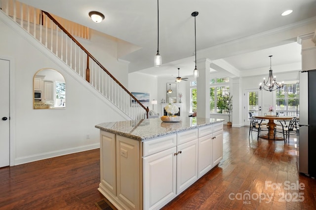 404 Brookridge Dr, Mount Holly, NC 28120 - kitchen featuring ceiling fan, dark wood finished floors, appliances with stainless steel finishes, plenty of natural light, and crown molding