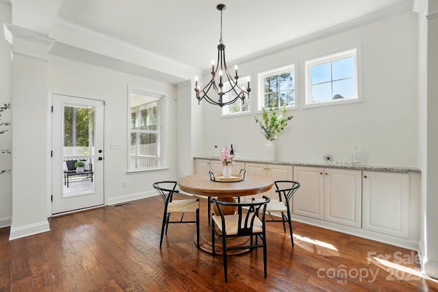 404 Brookridge Dr, Mount Holly, NC 28120 - dining area with a chandelier, ornamental molding, healthy amount of natural light, baseboards, and dark wood-style floors