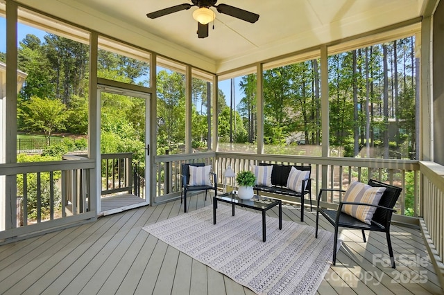 404 Brookridge Dr, Mount Holly, NC 28120 - sunroom featuring a ceiling fan, outdoor lounge area, and view of wooded area