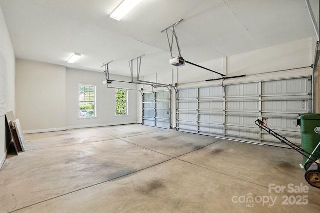 404 Brookridge Dr, Mount Holly, NC 28120 - garage with baseboards and a garage door opener