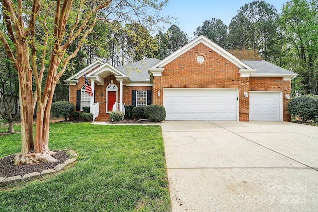 212 Kilborne Rd, Mooresville, NC 28117 - view of front facade with driveway, an attached garage, a front yard, brick siding, and a shingled roof