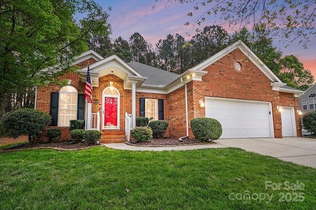212 Kilborne Rd, Mooresville, NC 28117 - view of front of home with brick siding, driveway, a garage, and a front lawn