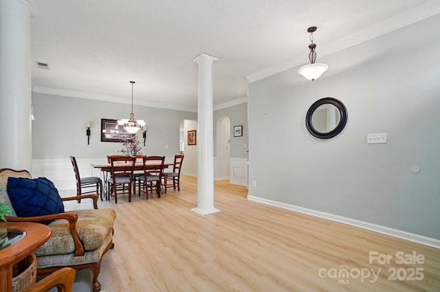 212 Kilborne Rd, Mooresville, NC 28117 - interior space featuring crown molding, decorative columns, light wood-style flooring, arched walkways, and visible vents