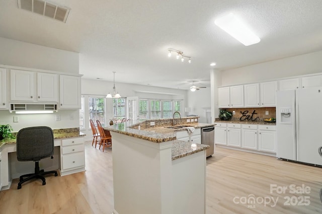 212 Kilborne Rd, Mooresville, NC 28117 - kitchen featuring light wood-style flooring, white refrigerator with ice dispenser, visible vents, stainless steel dishwasher, and a sink