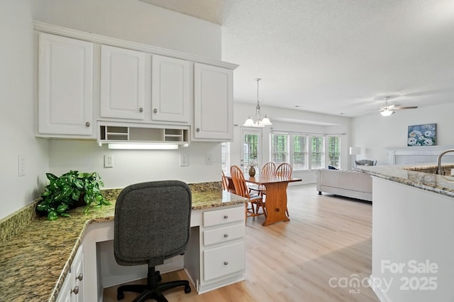 212 Kilborne Rd, Mooresville, NC 28117 - office with a sink, light wood finished floors, and ceiling fan with notable chandelier