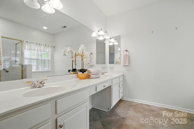 212 Kilborne Rd, Mooresville, NC 28117 - full bathroom featuring double vanity, a sink, a notable chandelier, and tiled shower