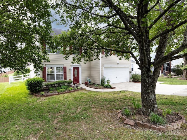 view of front facade featuring a garage, a front yard, concrete driveway, and fence