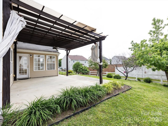 view of patio / terrace featuring a pergola, a ceiling fan, and fence