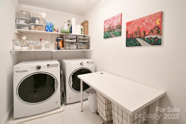 laundry room with laundry area and washing machine and clothes dryer