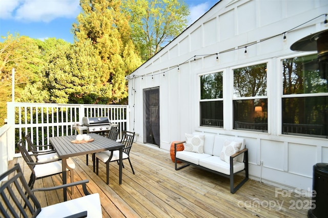 deck featuring a grill