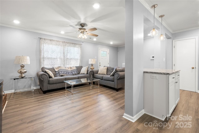 living room featuring light wood-style flooring, crown molding, ceiling fan, and recessed lighting