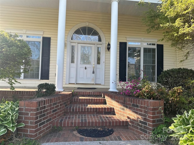 doorway to property with a porch