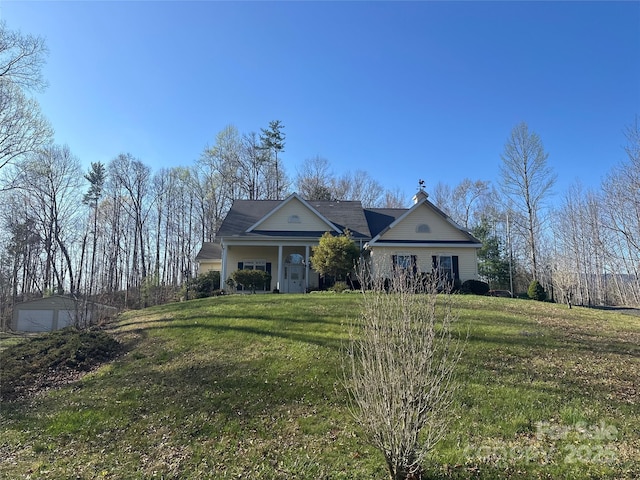 view of front of house featuring a garage and a front lawn