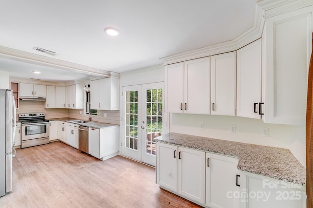 kitchen featuring french doors, light wood finished floors, visible vents, and stainless steel appliances
