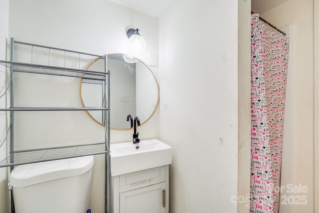 full bath with toilet and vanity