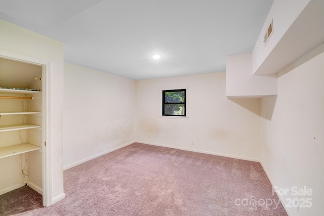 unfurnished bedroom featuring visible vents, baseboards, recessed lighting, and carpet flooring