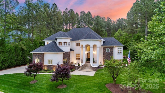 133 Crooked Branch Way, Troutman, NC 28166 - french country inspired facade featuring stucco siding, a front yard, and stone siding
