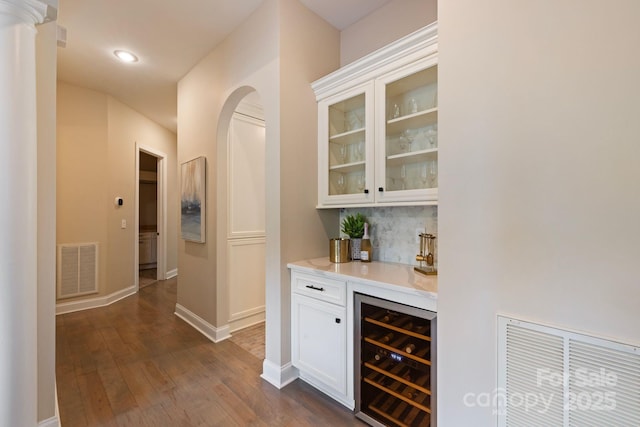 133 Crooked Branch Way, Troutman, NC 28166 - bar featuring dark wood finished floors, beverage cooler, backsplash, visible vents, and a dry bar