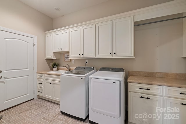 133 Crooked Branch Way, Troutman, NC 28166 - washroom featuring cabinet space, separate washer and dryer, brick floor, and a sink
