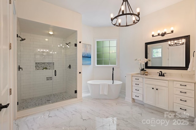 133 Crooked Branch Way, Troutman, NC 28166 - full bath with a shower stall, vanity, a notable chandelier, marble finish floor, and a freestanding bath