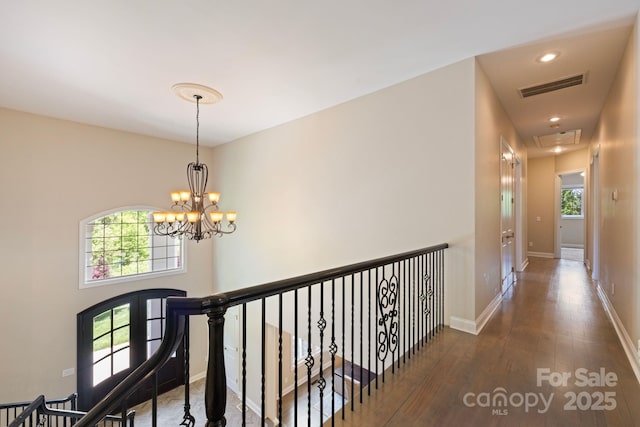 133 Crooked Branch Way, Troutman, NC 28166 - hall featuring visible vents, attic access, recessed lighting, wood finished floors, and a notable chandelier