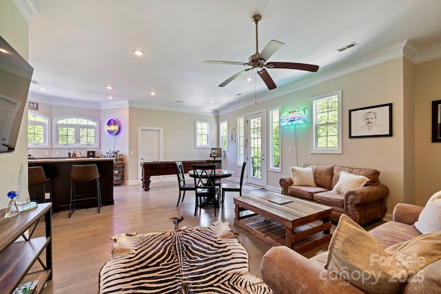 133 Crooked Branch Way, Troutman, NC 28166 - living area with plenty of natural light, recessed lighting, light wood-style flooring, and crown molding