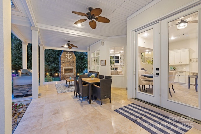 133 Crooked Branch Way, Troutman, NC 28166 - exterior space featuring ceiling fan, outdoor dining space, an outdoor stone fireplace, and french doors