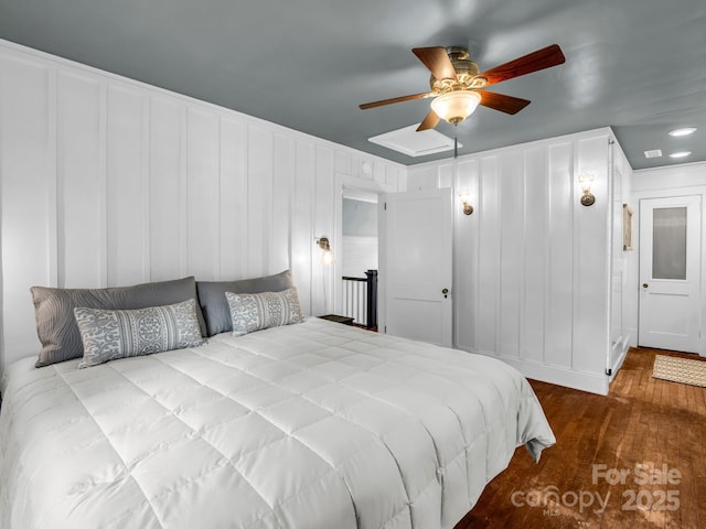 201 W 6th St, Rutherfordton, NC 28139 - bedroom featuring hardwood / wood-style floors, a decorative wall, and a ceiling fan