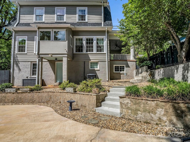 201 W 6th St, Rutherfordton, NC 28139 - view of front of property with stairs, a ceiling fan, cooling unit, a balcony, and a shingled roof