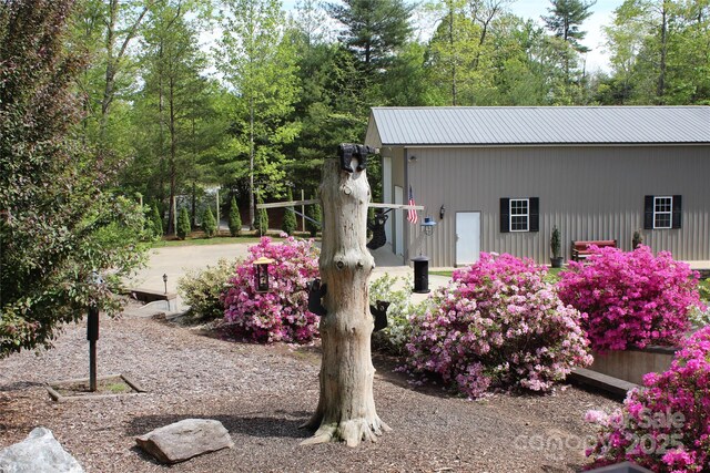exterior space with metal roof