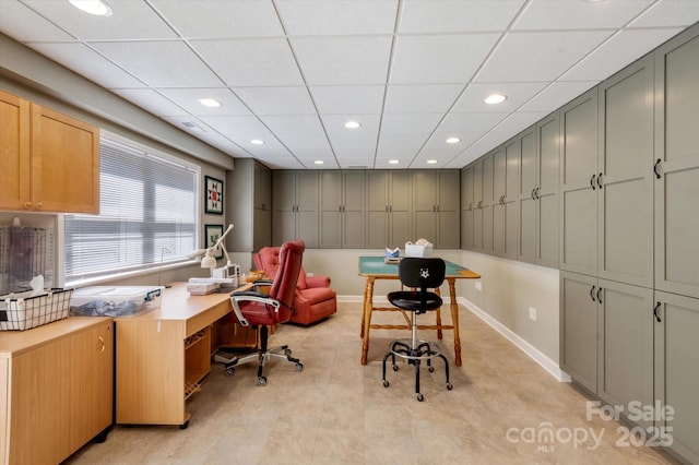 office with baseboards, a drop ceiling, recessed lighting, and visible vents