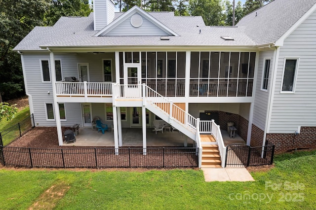 591 Emerald Isle Ct, Lexington, NC 27292 - rear view of property with a sunroom, a yard, a patio, stairs, and a chimney