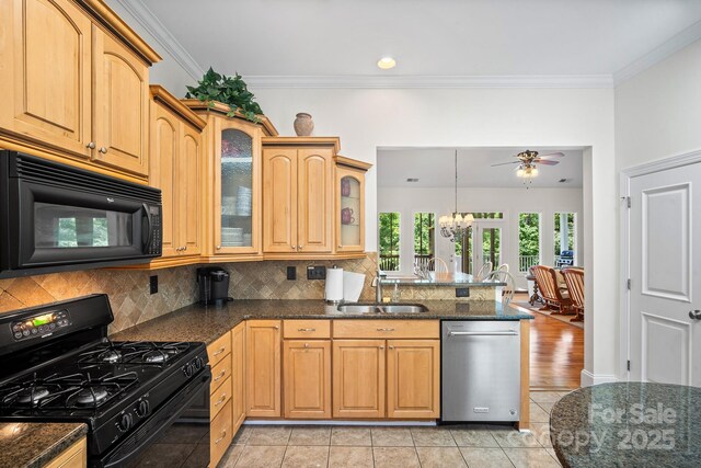 591 Emerald Isle Ct, Lexington, NC 27292 - kitchen featuring glass insert cabinets, tasteful backsplash, a peninsula, black appliances, and a sink