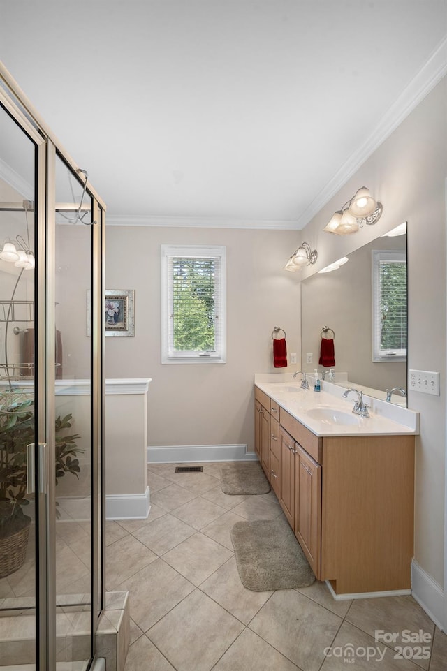 591 Emerald Isle Ct, Lexington, NC 27292 - full bath featuring baseboards, a sink, ornamental molding, double vanity, and a stall shower
