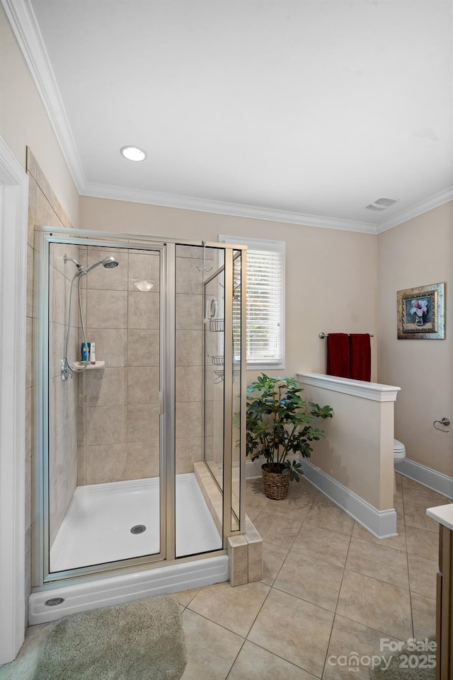591 Emerald Isle Ct, Lexington, NC 27292 - bathroom featuring crown molding, a shower stall, tile patterned flooring, toilet, and baseboards
