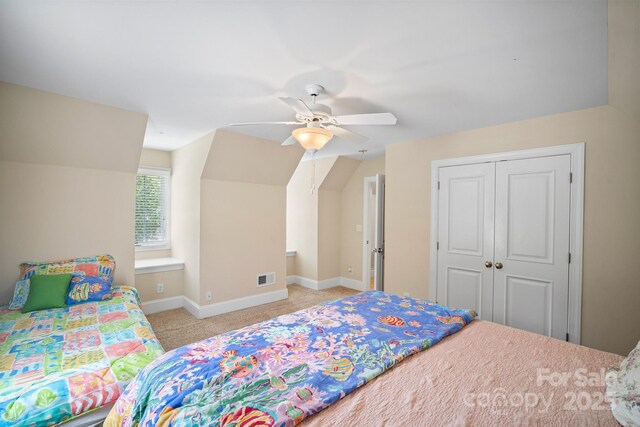 591 Emerald Isle Ct, Lexington, NC 27292 - bedroom featuring visible vents, baseboards, a closet, carpet, and vaulted ceiling