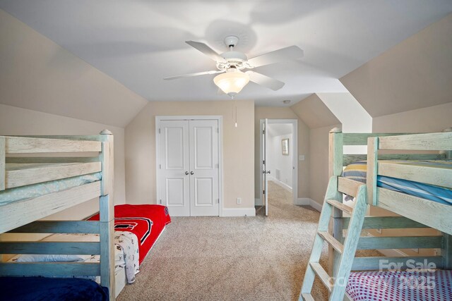 591 Emerald Isle Ct, Lexington, NC 27292 - carpeted bedroom featuring a closet, baseboards, a ceiling fan, and lofted ceiling