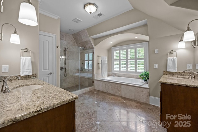 914 Elizabeth Ln, Matthews, NC 28105 - full bath with two vanities, healthy amount of natural light, a stall shower, a garden tub, and lofted ceiling