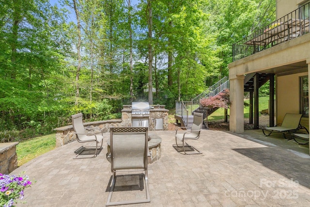 914 Elizabeth Ln, Matthews, NC 28105 - view of patio featuring stairway, exterior kitchen, a grill, and outdoor dining area