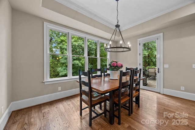 914 Elizabeth Ln, Matthews, NC 28105 - dining room with a chandelier, plenty of natural light, baseboards, wood finished floors, and ornamental molding