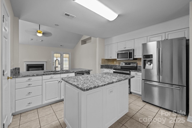 kitchen featuring a sink, visible vents, appliances with stainless steel finishes, and light tile patterned floors